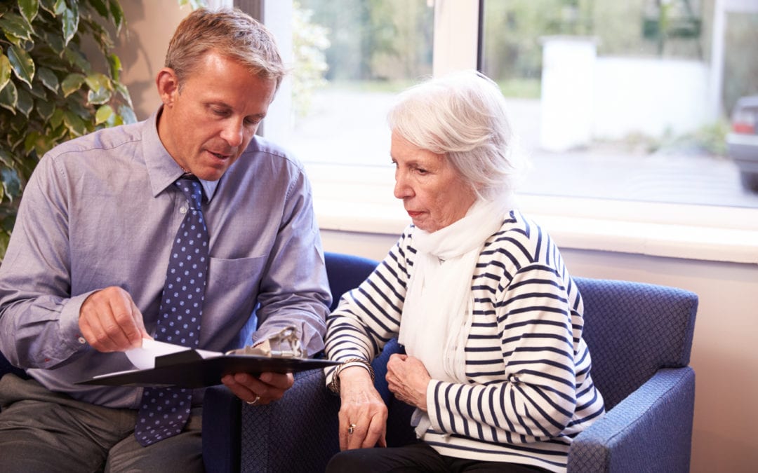 Friendly doctor discussing results with lady