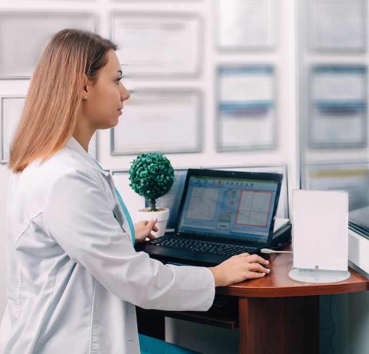 Hearing specialist sat at a desk Hearing specialist sat at a desk