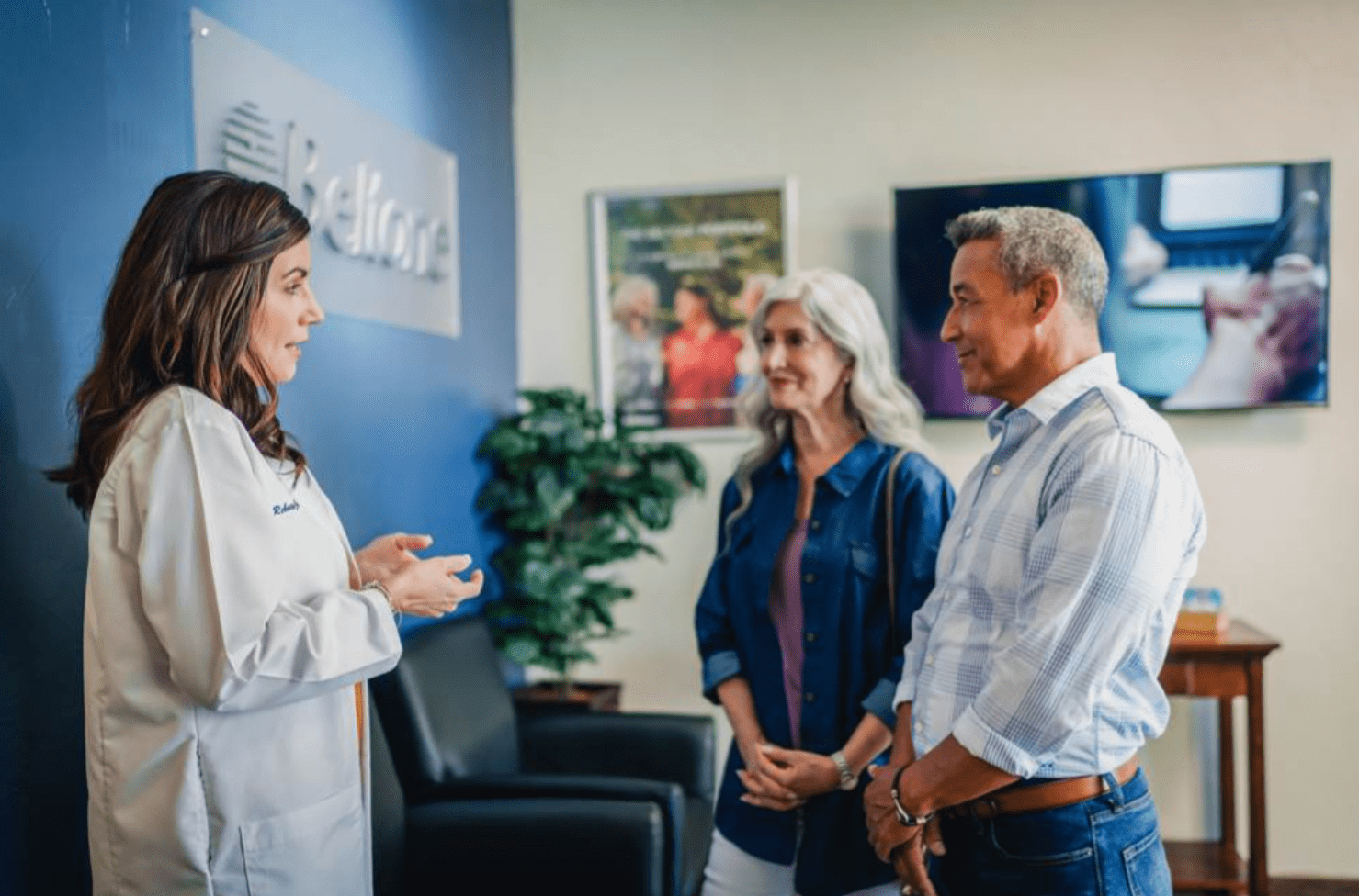 Beltone member of staff with patients